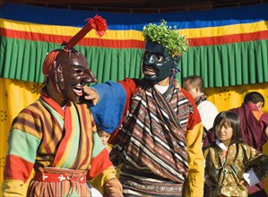 Bhutan, Thimpu Dzong, Two Atsaras, or comedians at a masked dance Tsecchu. 
Photo Nic I'Anson