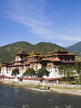 Bhutan, Punakha, Punakha Dzong beside river.