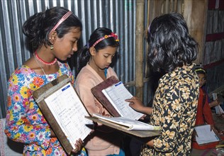 Bangladesh, Chittagong Division, Comilla, BRAC students in a primary classroom with peer marking.