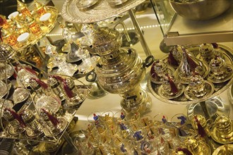 Turkey, Istanbul, Fatih, Sultanahmet, Kapalicarsi, Display of tea pots and cup in the Grand Bazaar.