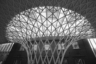 England, London, B&W shot of the metal structure inside Kings Cross Railway Station. . 
Photo