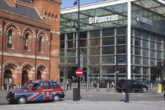 England, London, Taxi cabs outside the entrance to St Pancras Railway Station. 
Photo Stephen