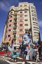 Spain, Valencia Province, Valencia, Typical falla scene with papier mache figures in the street