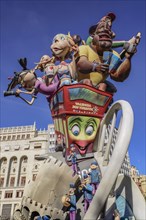 Spain, Valencia Province, Valencia, Las Fallas scene with Papier Mache figures on a Bus Turistic in Plaza Ayuntamiento during Las Fallas festival.