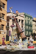 Spain, Valencia Province, Valencia, Falla scene with Papier Mache figures in the streets of the