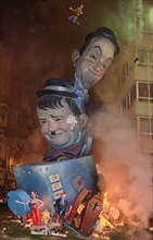 Spain, Valencia Province, Valencia, La Crema  The Burning of the Papier Mache figures in the street during Las Fallas festival on March 19th  Laurel and Hardy going up in flames.