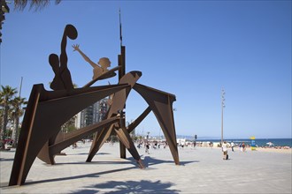 Spain, Catalonia, Barcelona, Playa de St Sebastia  Barceloneta Beach  Plaza del Mar  Swimming Hommage sculpture by Alfredo Lanz.