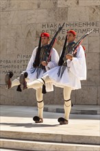 Greece, Attica, Athens, Greek soldiers, Evzones, marching beside Tomb of the Unknown Soldier,
