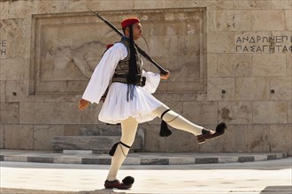 Greece, Attica, Athens, Greek soldier, Evzone, marching beside Tomb of the Unknown Soldier, outside