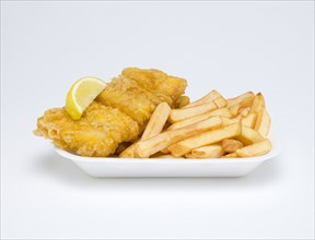 Food, Cooked, Fish, A portion of battered deep fried huss with a slice of lemon and potato chips