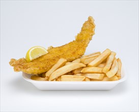 Food, Cooked, Fish, A portion of battered deep fried cod with a slice of lemon and potato chips