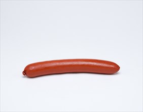 Food, Cooked, Meat, Single saveloy on a white background.