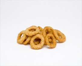 Food, Cooked, Vegatables, Battered fried onion rings on a white background.