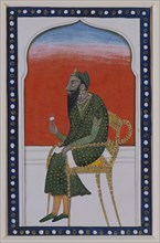 Kharak Singh, Seated Man Holding a Flower