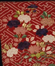 Detail of a Kimono; flowers on a lattice ground; silk crêpe with tie-dyed (shibori), resist-dyed (yuzen), stencilled (kata-kanoko) & embroidered decoration; Japanese; 1800 - 30.