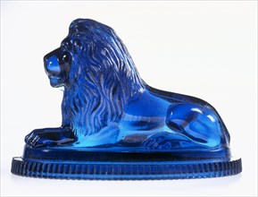 Lion paperweight; blue pressed glass;made by John Derbyshire (act. 1856 - 93), Regent Flint Glass Works; English (Manchester);1874.