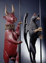 A statue of an heraldic bull & a statue of an heraldic gryphon (2  of a set of 4); carved & painted oak;made for Thomas, Lord Dacre (1467 - 1525);English;1500 - 25.