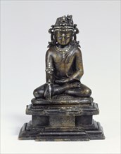 Small seated Buddha. 11th - 12th century