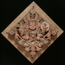 Panneau sculpté réprésentant une déité bouddhique