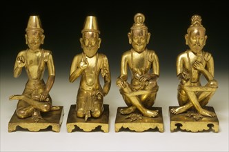 Ensemble de statuettes représentant des saints bouddhiques