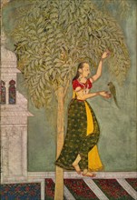 Femme tenant un perroquet