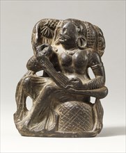 Seated musician. Pakistan, 5th - 6th century A.D.