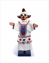 Glove puppet of a white faced clown, by Fred Tickner. England, 20th century
