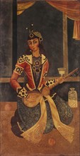 Lady seated playing the guitar. Iran, Qajar dynasty, early 19th century