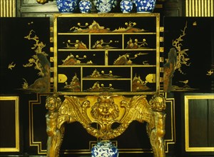 Oriental lacquered cabinet on stand. England, 17th century