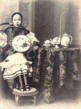 China, young sophisticated woman at home