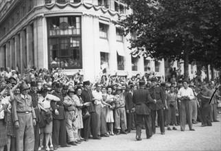 Scene of cheering crowd on the Champs-Elysées, Paris, during the Liberation (August 1944)