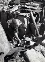 Old woman from Nuremberg coocking a poor meal