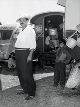 Gypsy people before a caravan