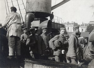 German prisoners walking down the fake bridge of the Montreal, 1914