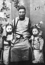 Pu Yi with his grandfather, at the age of 5.