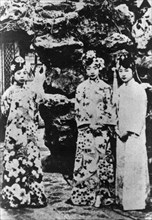 Empress Wan Rong, Wen Xiu and Tang Shi Xia, in a garden in the Forbidden City