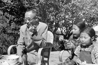 Pu Yi and his family in his yard in Beijing, September 1961