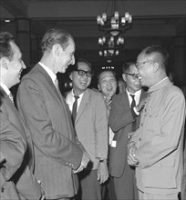Pu Yi speaks with journalists, during a cocktail party, 1965