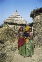 On the road to Deeg, Small village with resident family