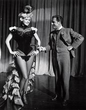 Film still of Jayne Mansfield on stage in The Sheriff of Fractured Jaw