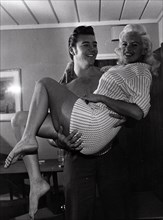 Jayne Mansfield being carried by her husband