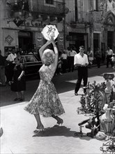 Jayne Mansfield dancing with a tambourine