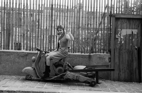 Young woman on a scooter
