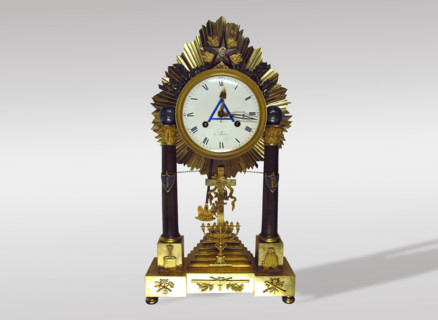 Clock in bronze gilded with mercury.