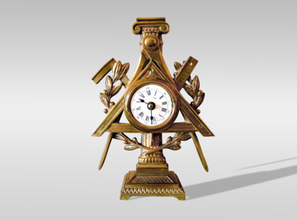 Bronze clock with Masonic motifs.