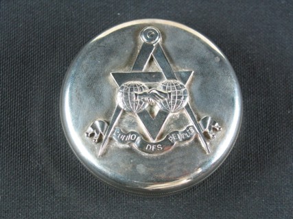 Silver-plated metal case.