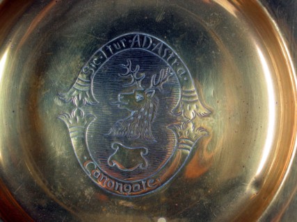 Central motif of a brass dish.