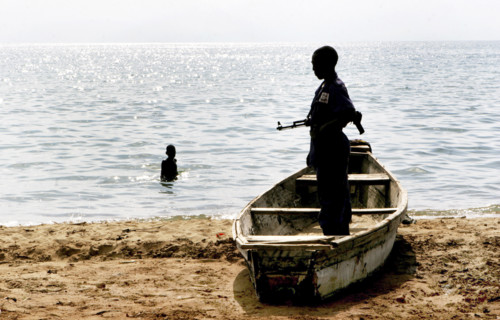 Burundi, A government soldier on a beach of lake Tanganjika near the border of Tanzania. Previous