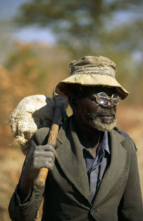 ELDERLY ZIMBABWEAN MAN WITH "DO IT YOURSELF" SPECTACLE REPAIRS, ZIMBABWE