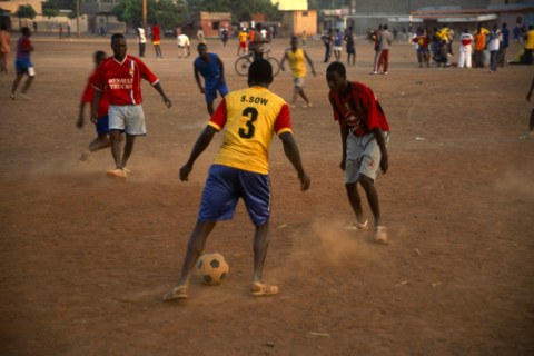 In the suburb of Corofina Nord, Bamako, Mali, young people gather in the late afternoon at a large